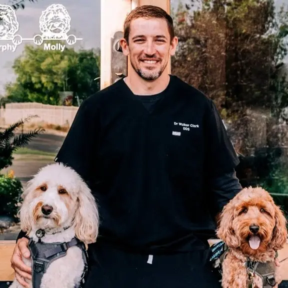 Therapy dogs at a pediatric dental office in Salt Lake City - 5-7-26 - 2 pediatric dentist at door of Stansbury Park with therapy dog